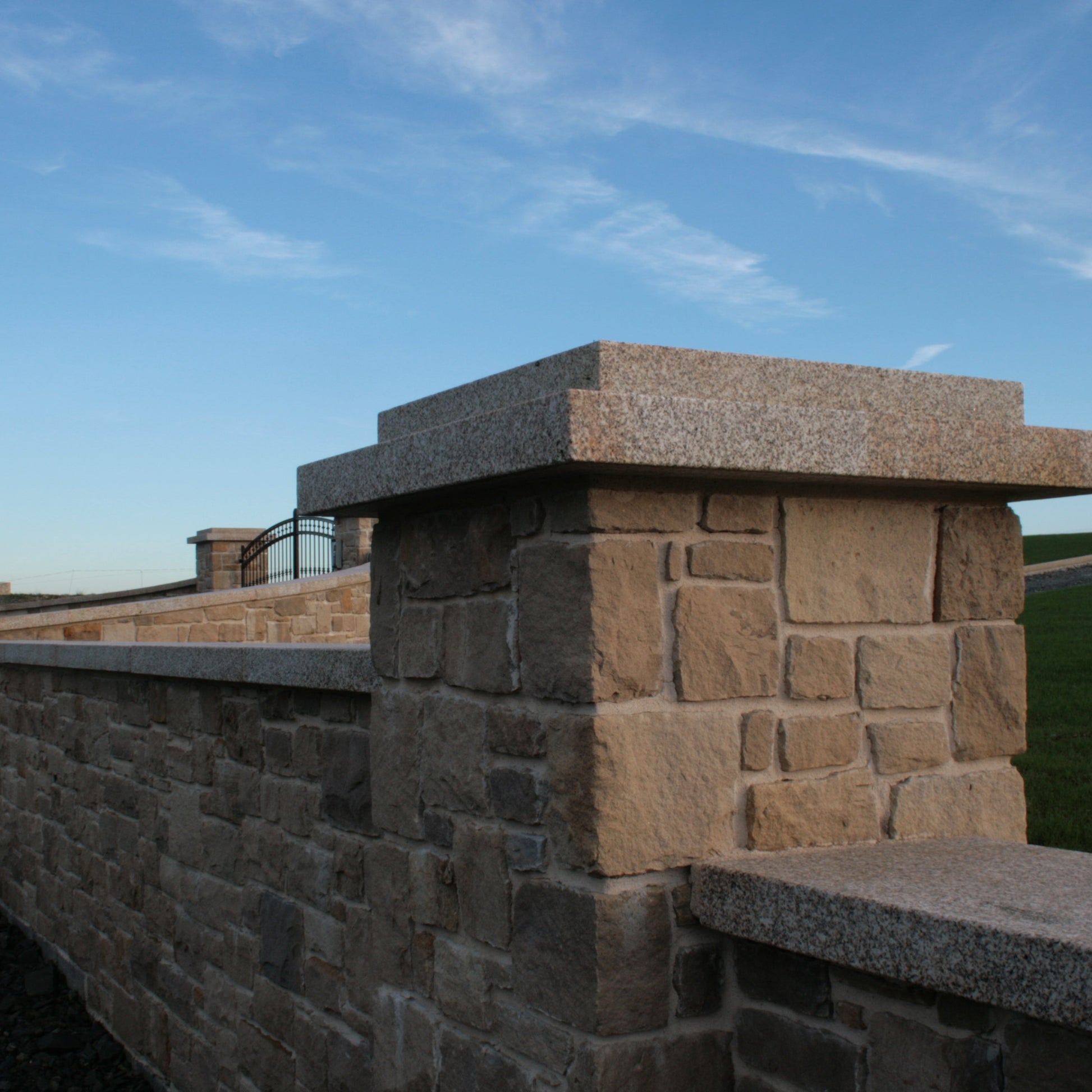 Boundary wall and pillar finished in Mountcharles Sandstone Stoneer Cladding. 