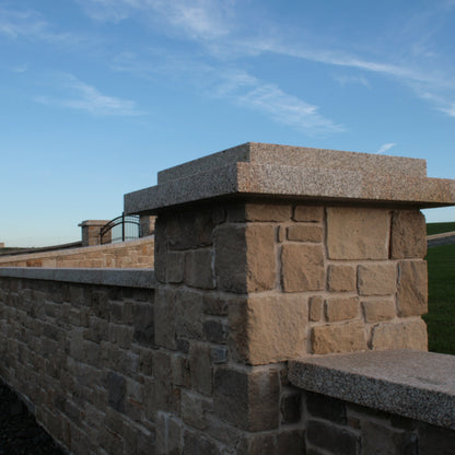 Boundary wall and pillar finished in Mountcharles Sandstone Stoneer Cladding. 