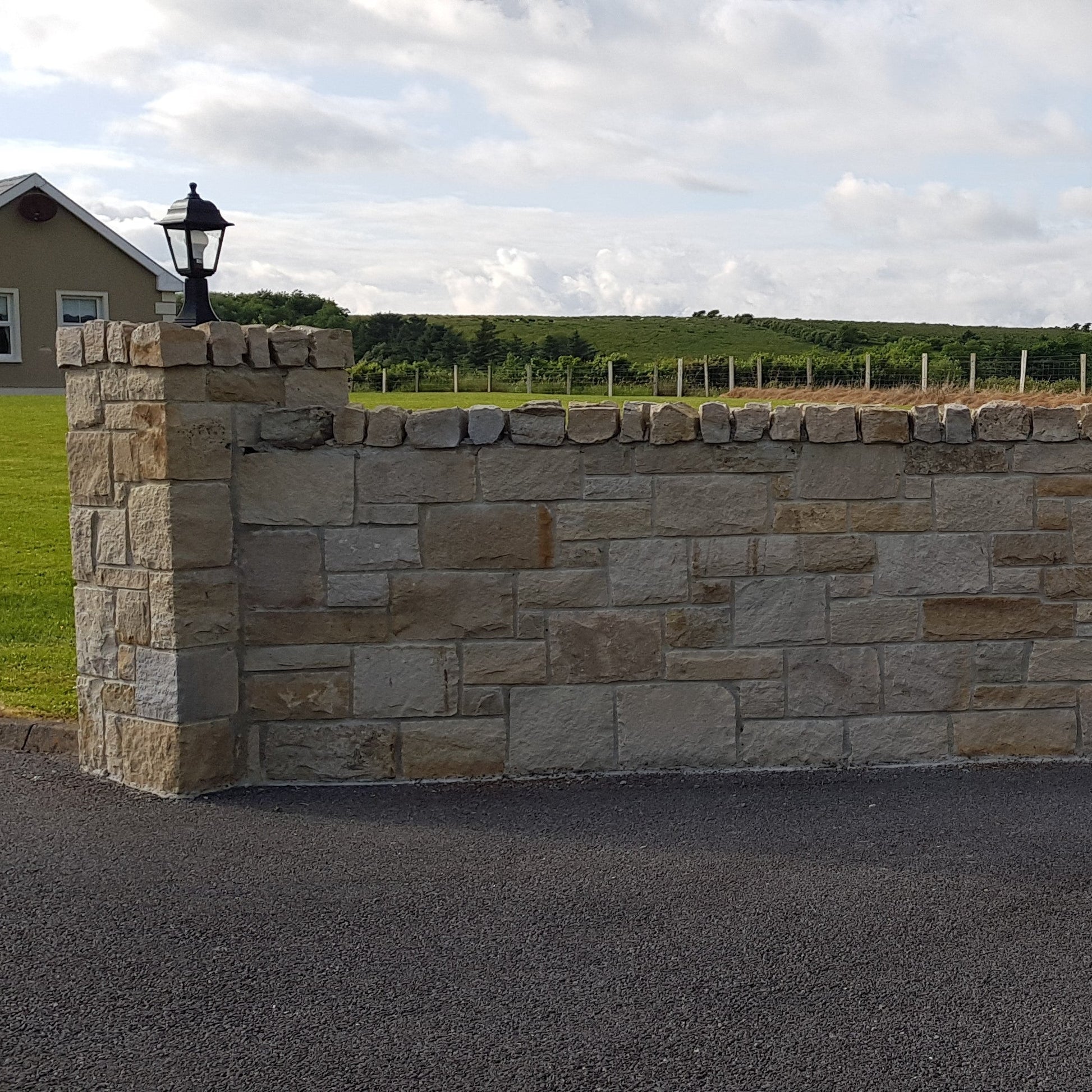 Boundary wall and pillar completed using Mountcharles Sandstone Stoneer Cladding. 