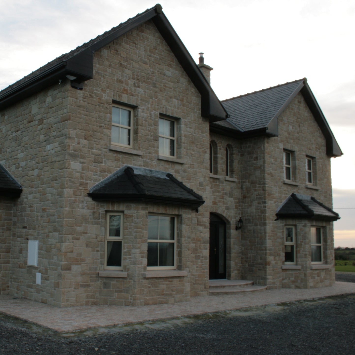 Large stone house completed using Mountcharles Sandstone Stoneer Cladding. 