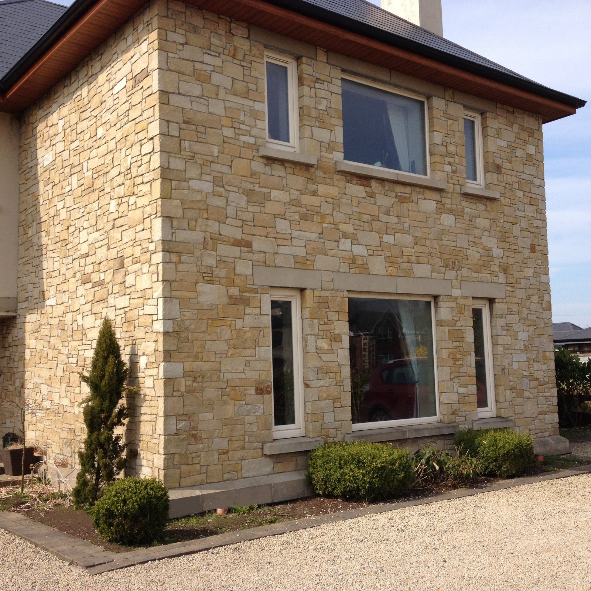 Stone house completed using Mountcharles Sandstone Stoneer Cladding and Sandstone Sills and Lintels. 