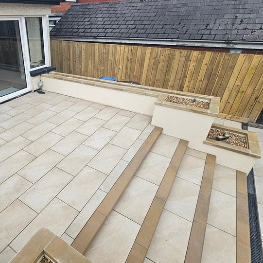 Patio planter wall completed with bespoke flat Mountcharles Sandstone Wall Capping. 
