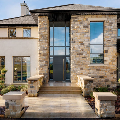 Modern new build with entrance walls completed with bespoke flat Sandstone Wall Capping. 