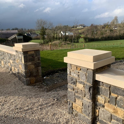 Stone garden walls completed with bespoke sandstone wall and pillar caps. 