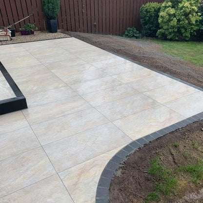 Garden and patio area featuring Pietra Di Barge porcelain tiles. 