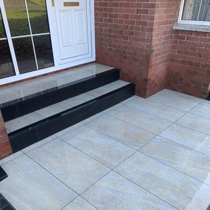 House entrance with steps completed in Pietra Di Barge porcelain tiles. 