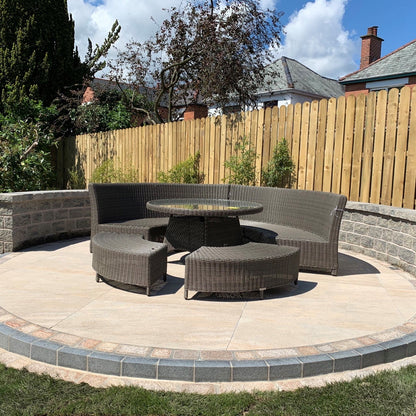 Raised circular patio seating area finished using Pietra Di Barge porcelain tiles