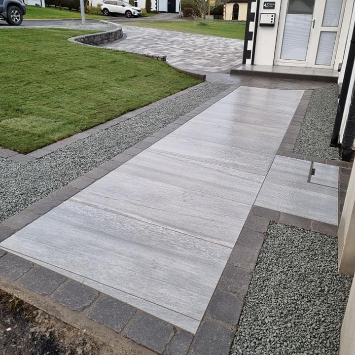 Pathway leading to driveway completed using Pietra Di Vals Porcelain Tiles. 