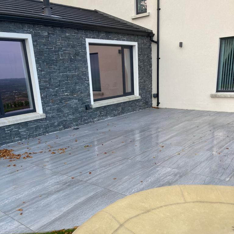Patio area showcasing Pietra Di Vals Porcelain Paving.