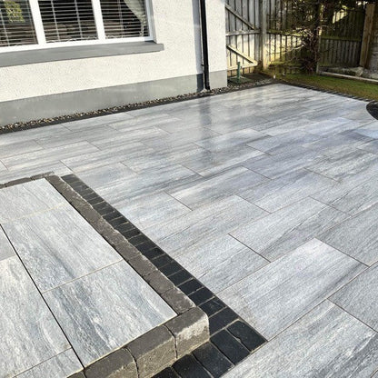 Patio and step installed using Pietra di Vals porcelain tiles in 900 x 450 x 20mm size. 