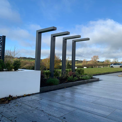Landscape design featuring Pietra di Vals porcelain tiles.