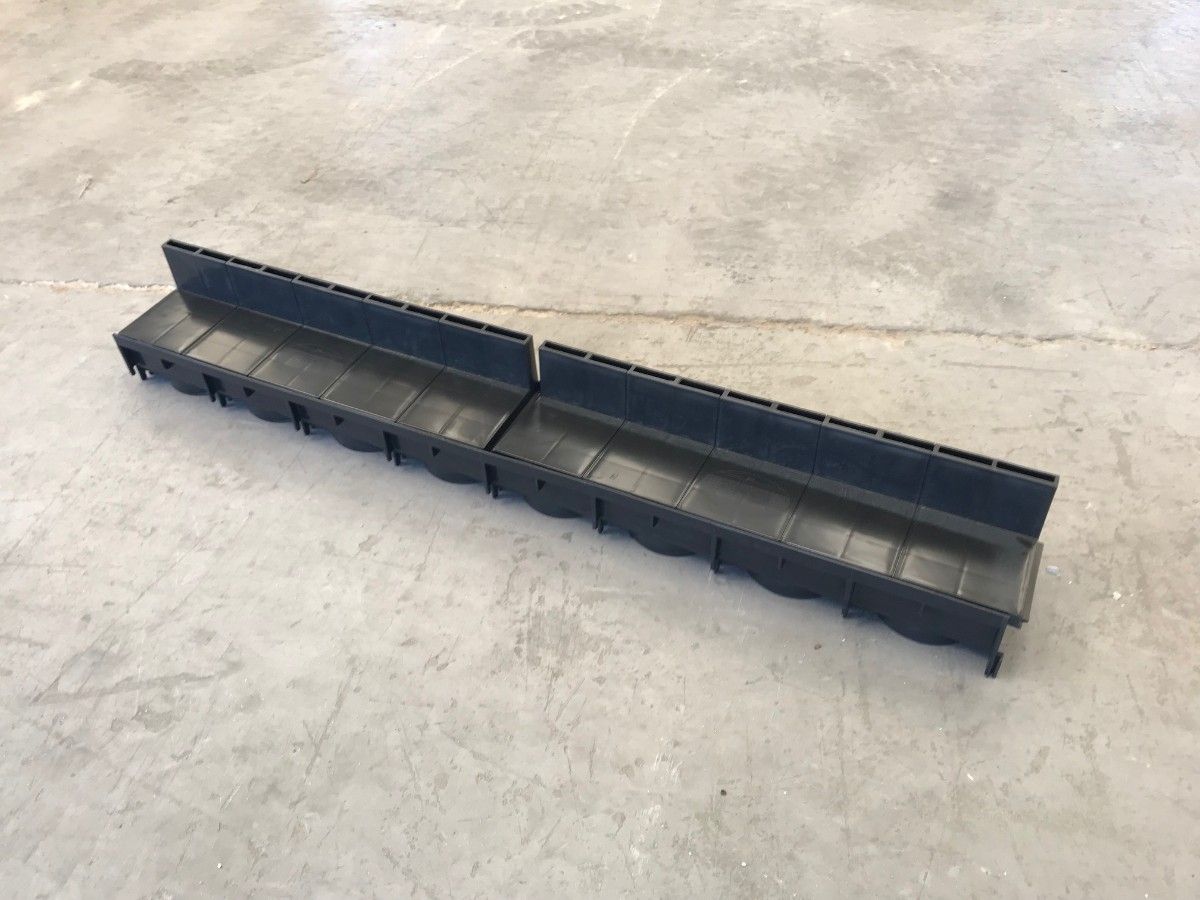 The front view of a Poly Brick Slot Channel Drain. 