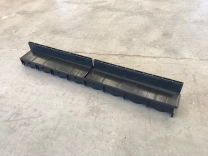 The front view of a Poly Brick Slot Channel Drain. 