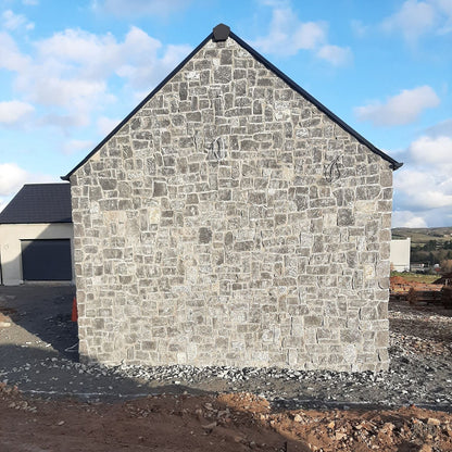 Gable wall cladded in stone featuring Rustic Blue Limestone Stoneer Cladding.