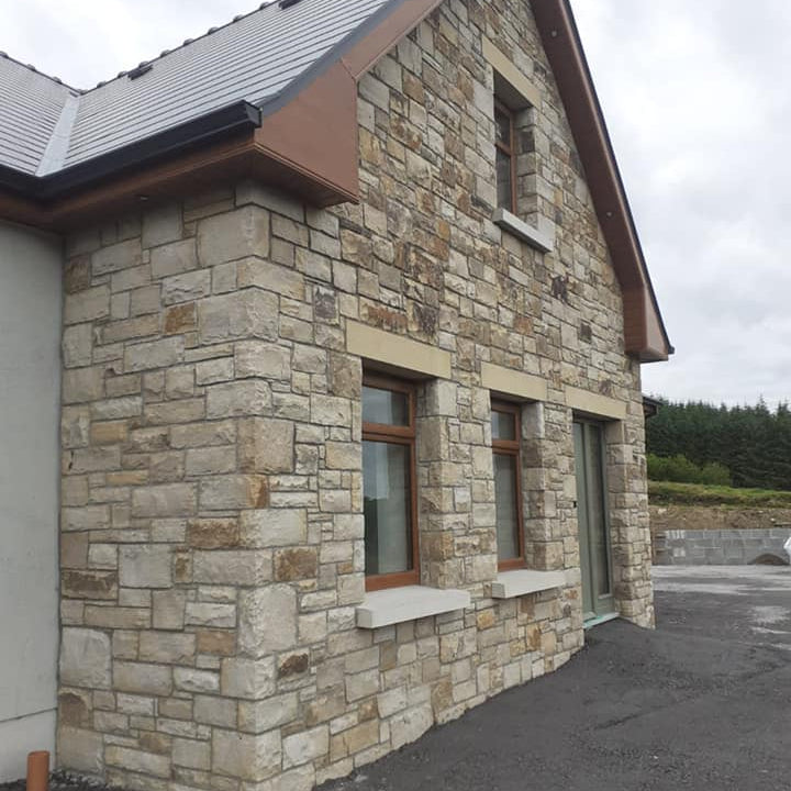 Stone façade with bespoke sandstone lintel and sills. 