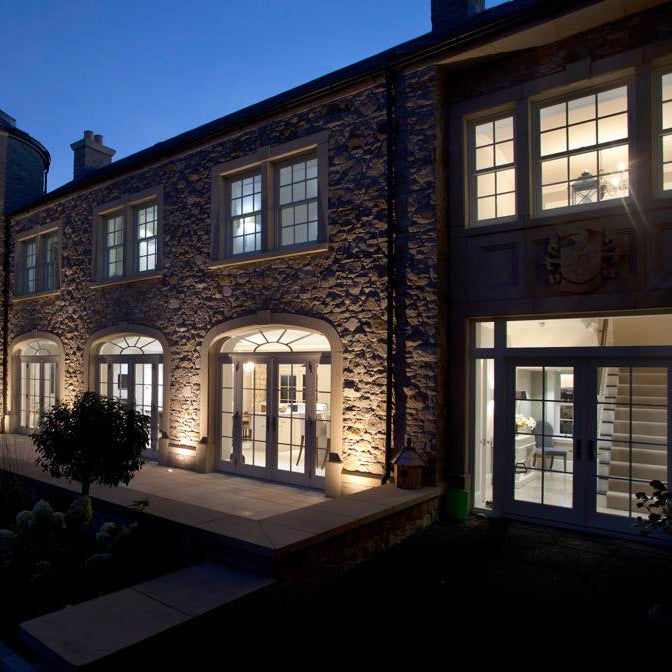 Close up of the architectural sandstone window and door surrounds. 