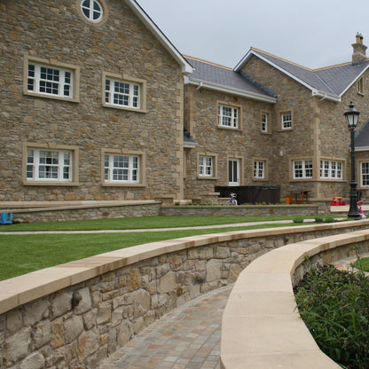 Large two storey stone house with bespoke Sandstone Window Surrounds.