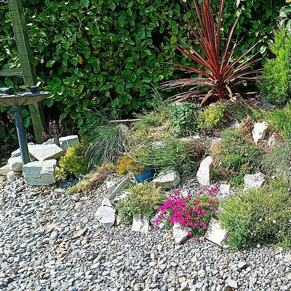 Planted rockery area featuring Silver Donegal Quartzite Rockery Stones. 