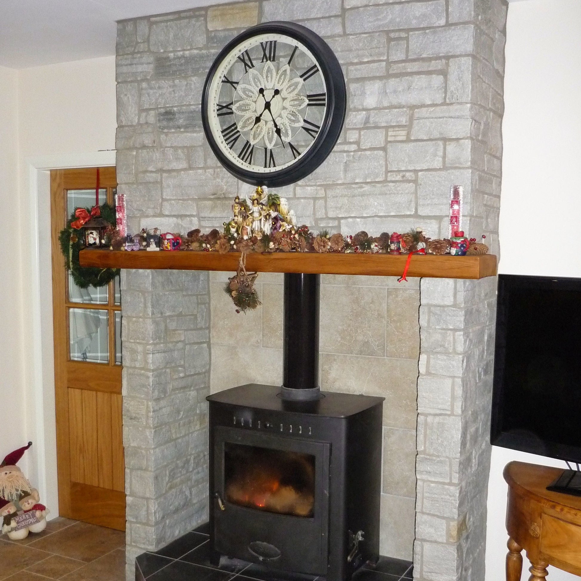 Internal fireplace clad in Silver Donegal Quartzite Stoneer cladding. 