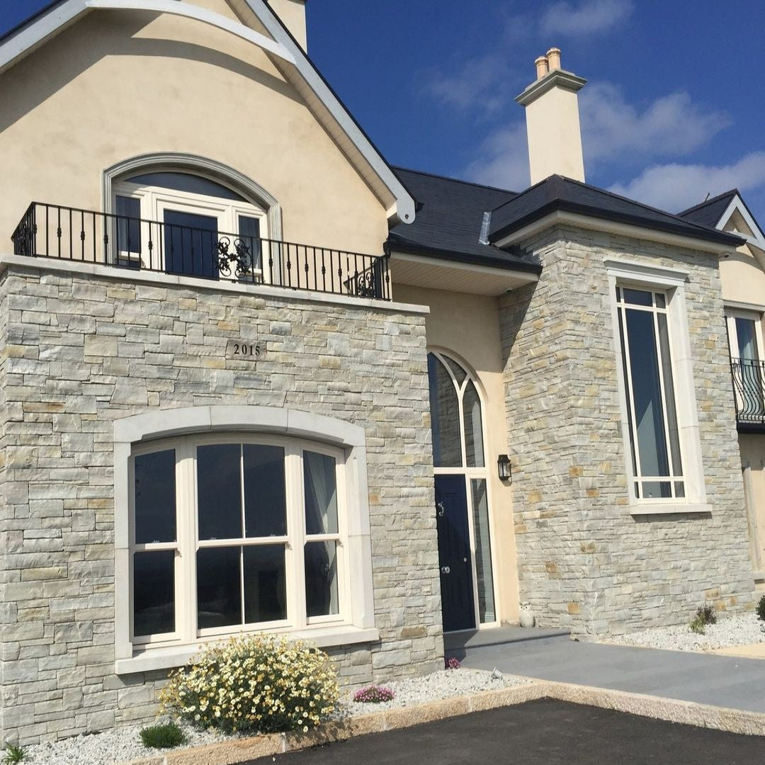 Modern home with stone facades completed in 30mm Silver Donegal Quartzite Stoneer Cladding.