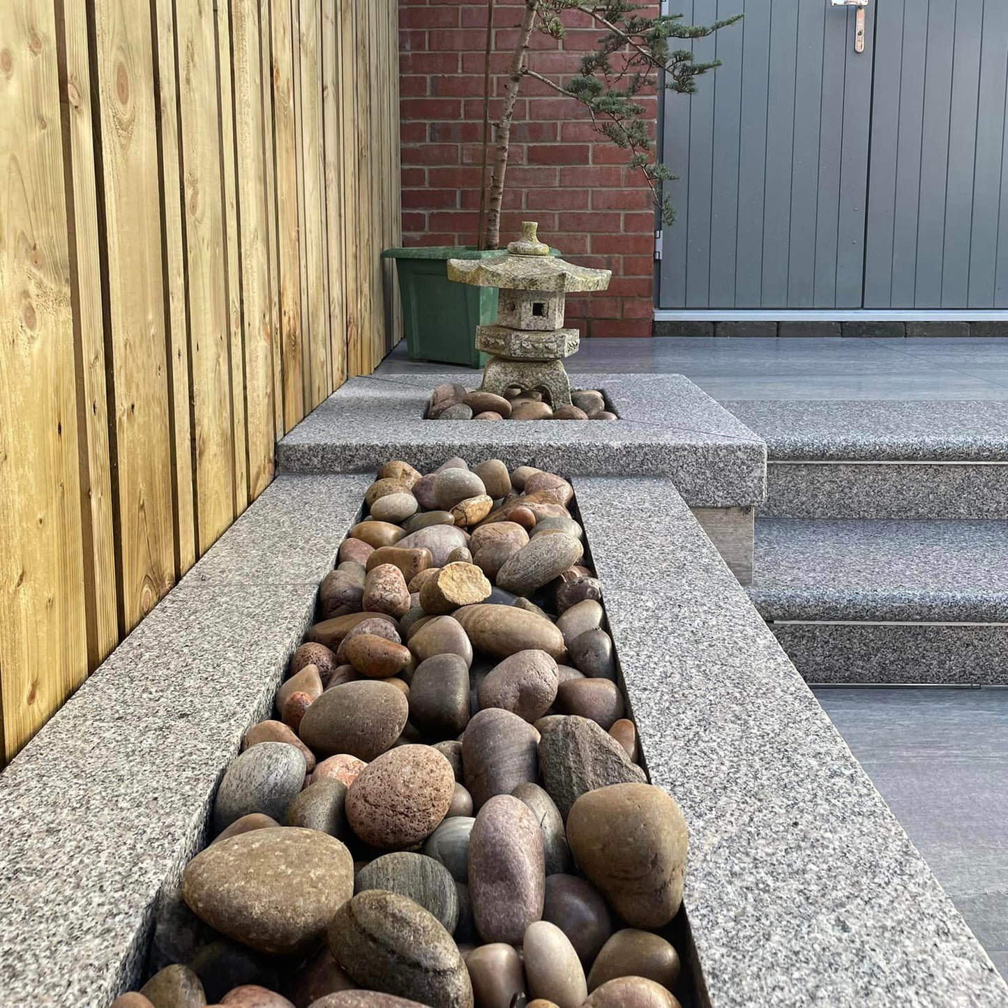 Patio wall completed with Silver Granite Wall Capping. 
