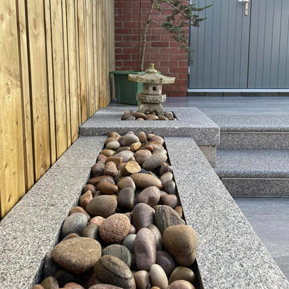 Patio wall completed with Silver Granite Wall Capping. 