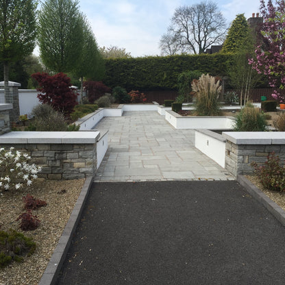 Entrance wall and Patio with raised planter walls completed with Silver Granite Wall Capping 