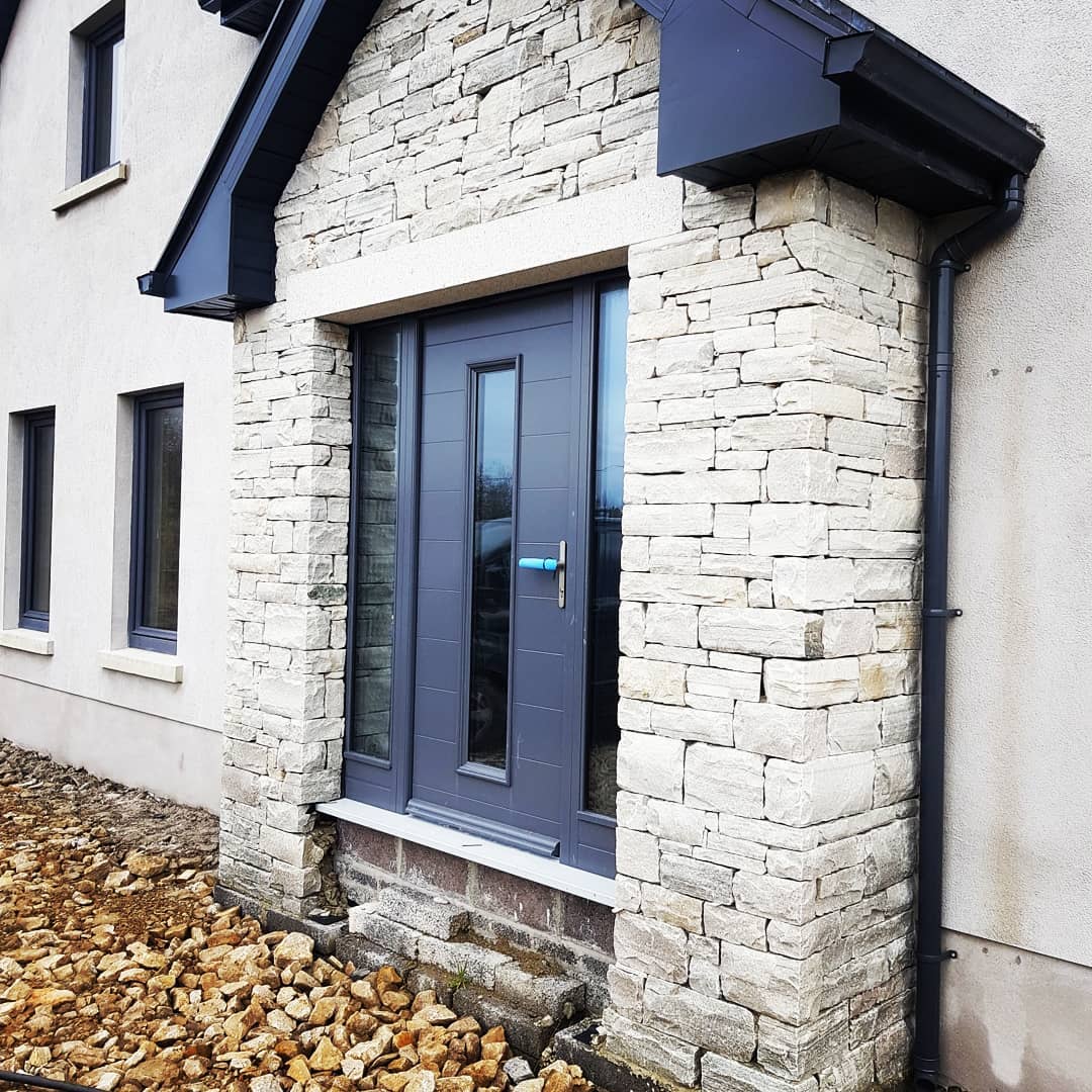 Quartzite stone porch with bespoke silver granite door lintel. 