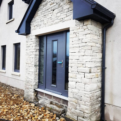 Quartzite stone porch with bespoke silver granite door lintel. 