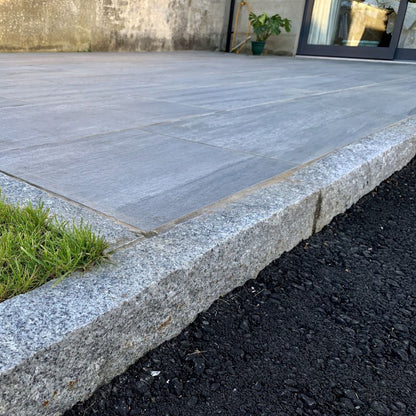 Close up of Silver Granite Kerbs with a pineapple finish. 