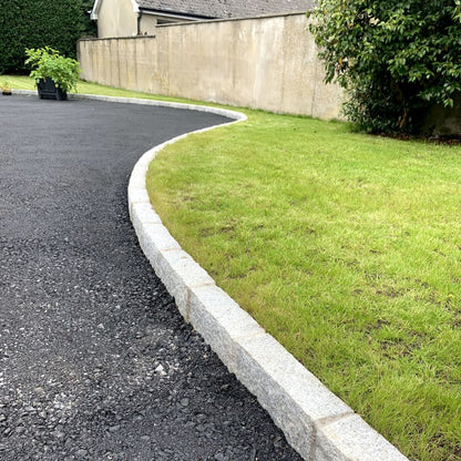 Driveway edging featuring Silver Granite Kerbs with pineapple finish. 