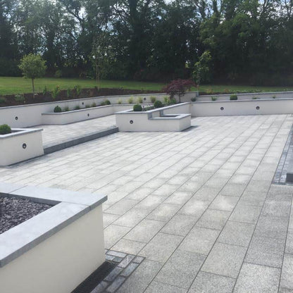 Large patio area featuring Silver Granite Paving in 600 x 300mm size. 