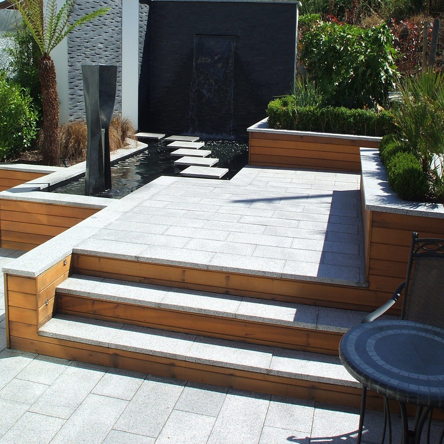 Show garden design featuring Flamed Silver Granite Paving in 600x300mm size. 