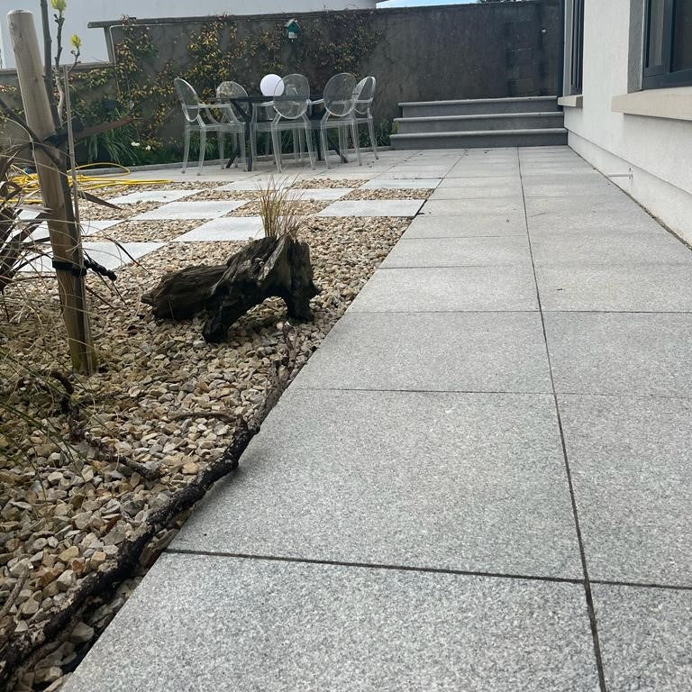 Patio area featuring Silver Granite Paving in 600 x 600mm size. 