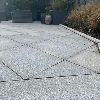 Patio area featuring Silver Granite Paving in 600 x 600mm size. 