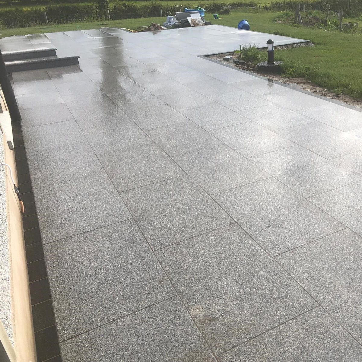 Patio area with steps Paving is Silver Granite Paving in 900 x 600mm size. 