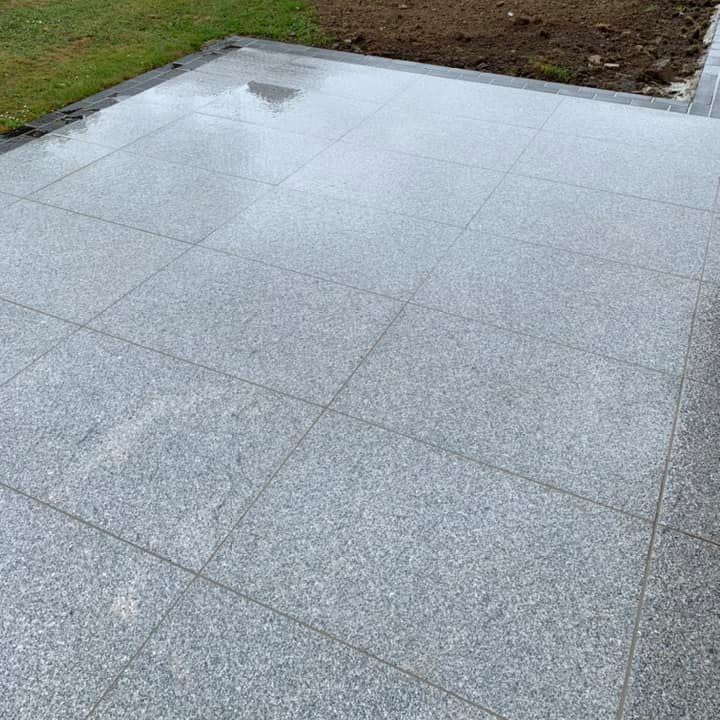 Patio area completed with Silver Granite Paving in 900 x 600mm size. 