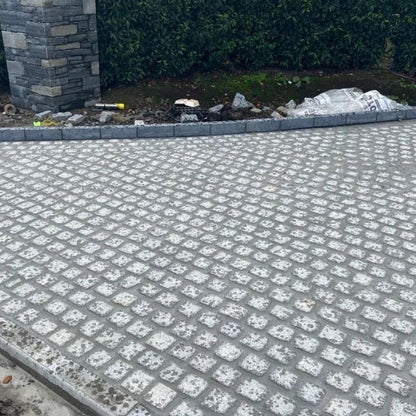 Driveway nearing completion with Silver Granite Paving Cobbles in 100 x 100mm size.