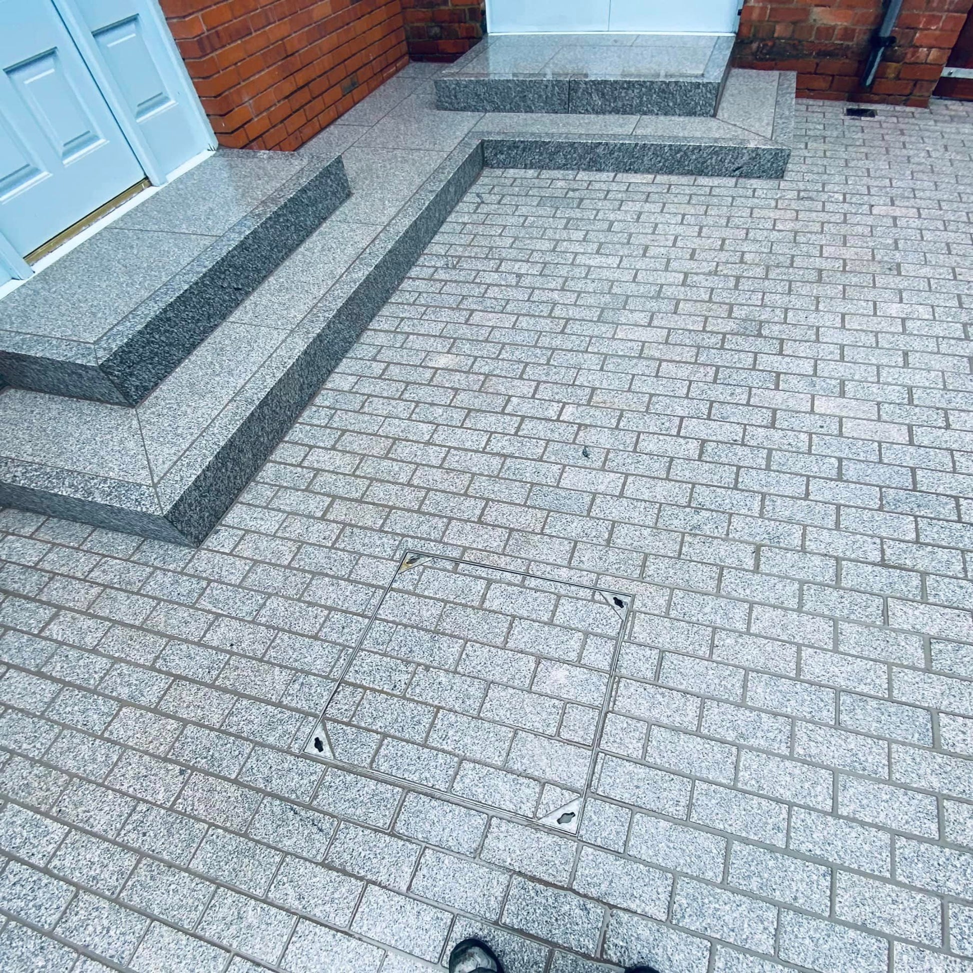 Patio with steps completed using Silver Granite Sawn Paving Cobbles with a flamed finish in 200 x 100mm size.