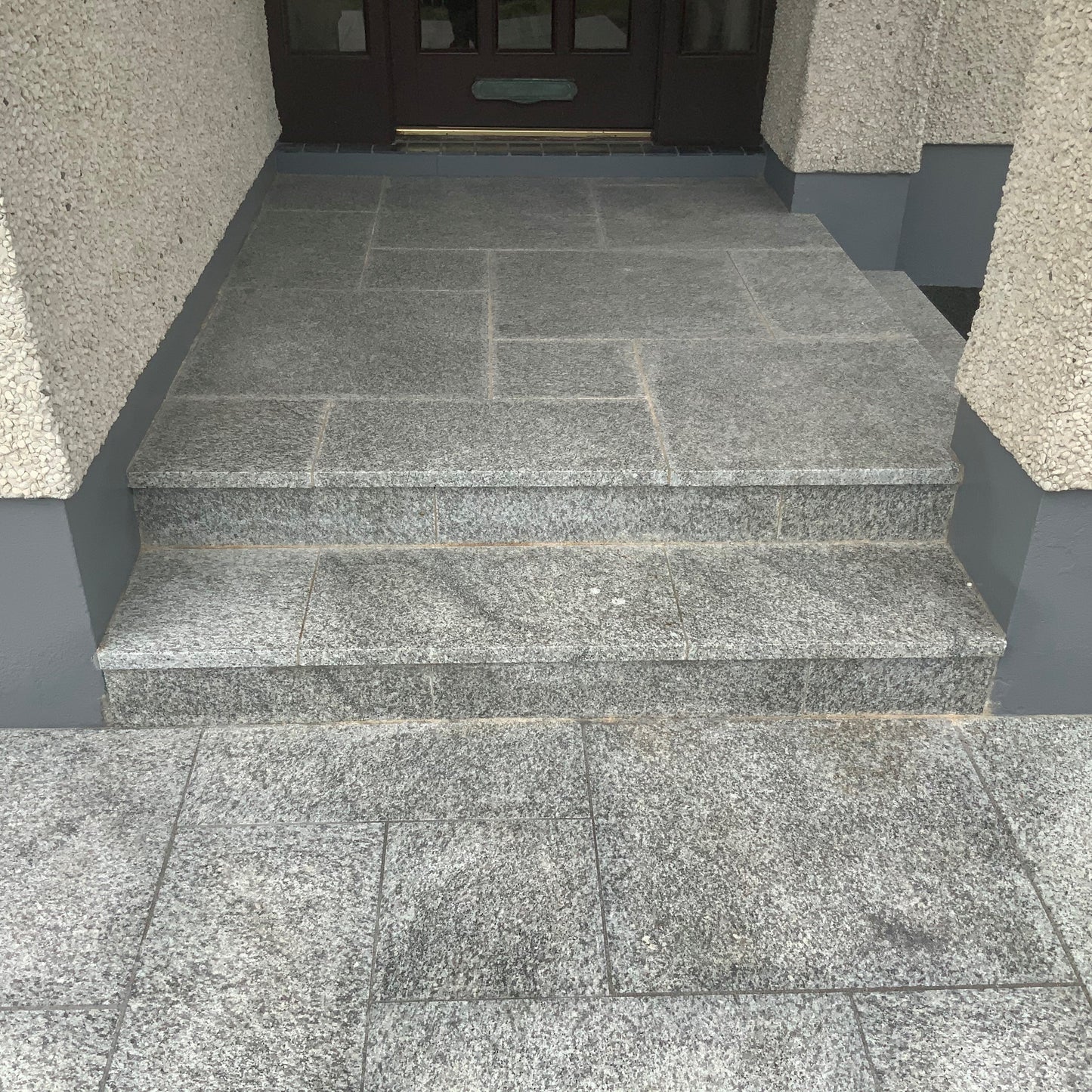 Entrance completed using Silver Granite Paving Patio Packs in mixed sizes. 