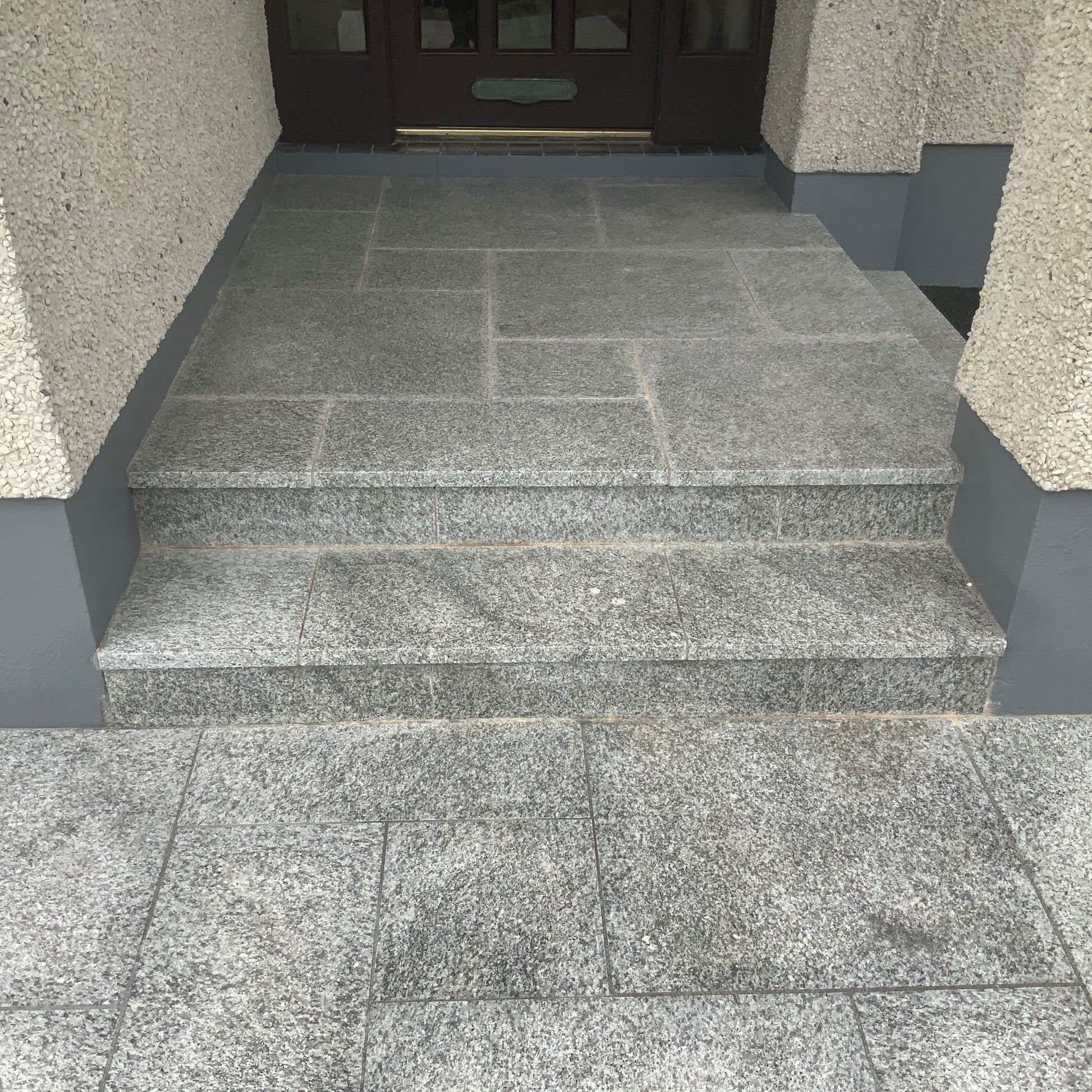 Entrance completed using Silver Granite Paving Patio Packs in mixed sizes. 