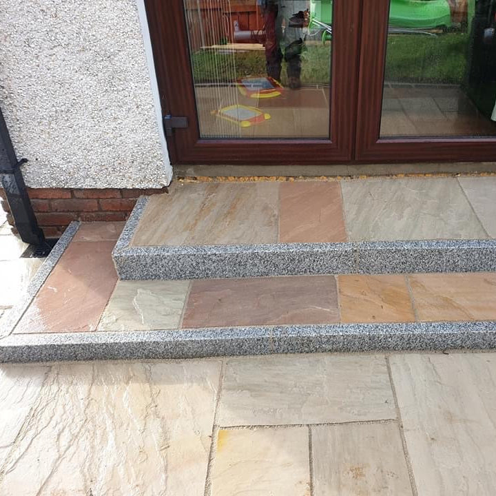 Step leading up to a door completed using Silver Granite Pin Kerbing.