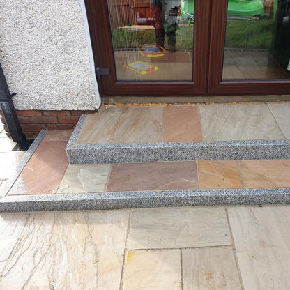 Step leading up to a door completed using Silver Granite Pin Kerbing.