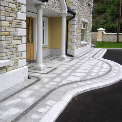 Close up of Silver Granite Portico Columns leading to house entrance. 