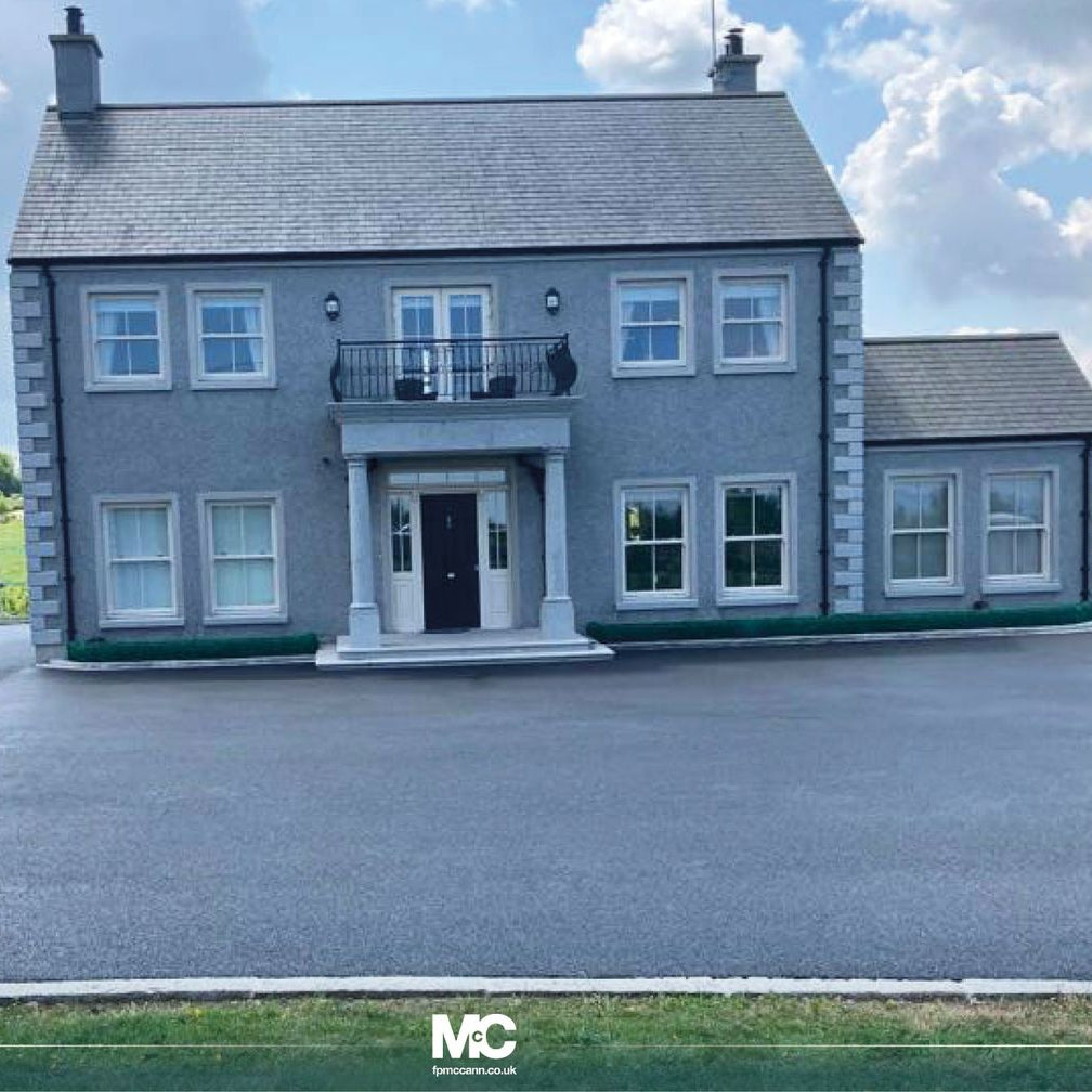Large two storey house with Silver Granite Portico and steps. 