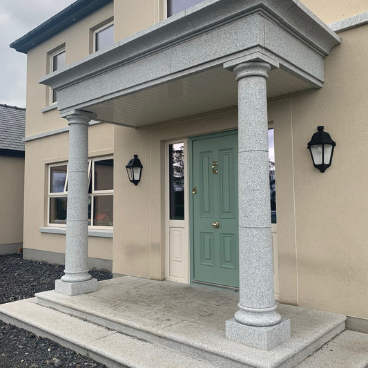 Front entrance of a house with a green door and Silver Granite Portico and Steps. 