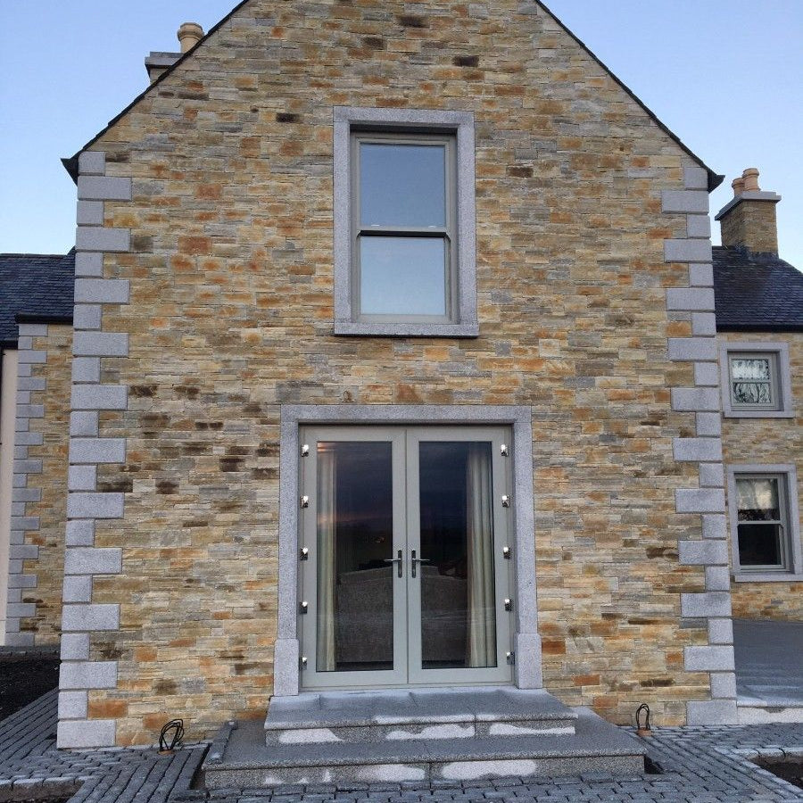 Stone house with Bespoke Silver Granite Quoins and Surrounds. 