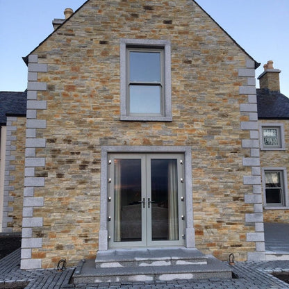 Stone house with Bespoke Silver Granite Quoins and Surrounds. 