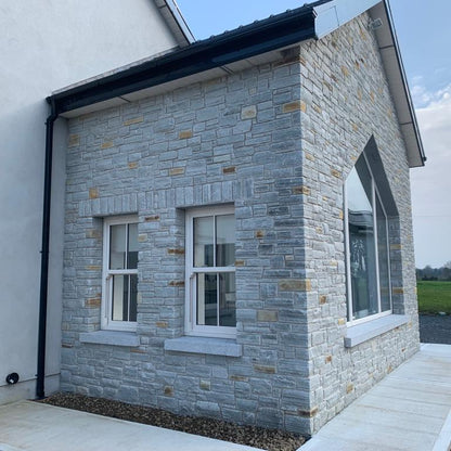 Stone sunroom with bespoke Silver Granite Window Sills.