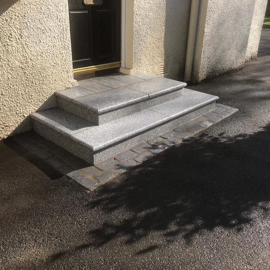 Set of stone steps completed using Silver Granite Corner Steps in 600 x 300 x 30mm with 2 bullnose edges. 